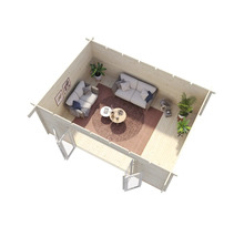 Vue intérieure d'une cabane de jardin avec canapés, table et plantes.