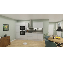 Cuisine claire avec kitchenette, table à manger et robot aspirateur sur parquet