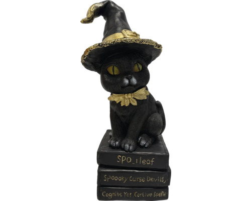 Figurine décorative de chat avec un chapeau de sorcière sur une pile de livres comme décoration d'Halloween