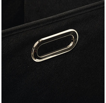 Gros plan d'une boîte de rangement noire avec poignée