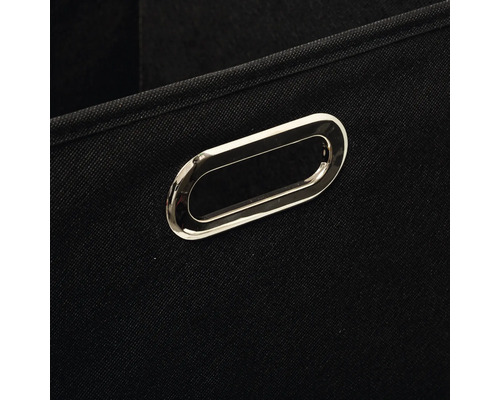 Gros plan d'une boîte de rangement noire avec poignée