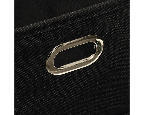 Gros plan d'une boîte de rangement noire avec une poignée argentée