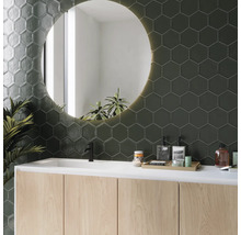 Salle de bain moderne avec carreaux hexagonaux, meuble-lavabo et miroir rond