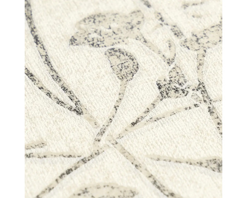 Papier peint intissé avec motif floral de branches et de fleurs, surface texturée.