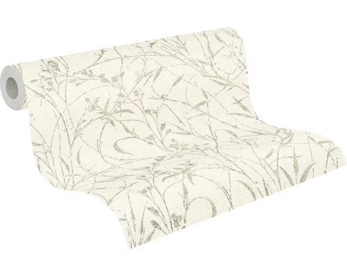 Papier peint intissé partiellement déroulé avec motif de graminées délicat.