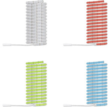 Quatre bobines de rubans LED flexibles dans les couleurs de lumière blanc, rouge, vert et bleu avec câbles de connexion.