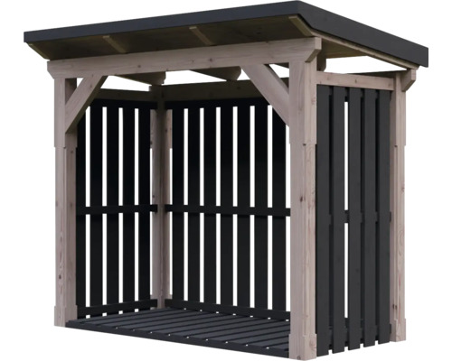 Abri à bûches en bois avec toit en appentis, parois en lattes sombres et plancher.