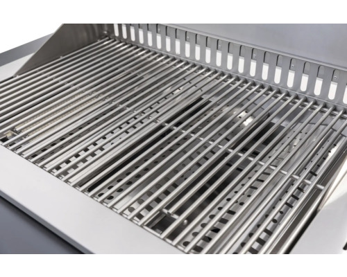 Gros plan d'une grille de barbecue en acier inoxydable