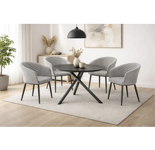 Esszimmer mit rundem Esstisch und vier Armlehnstühlen