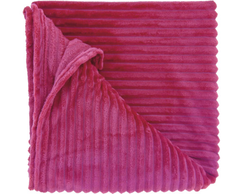 Couverture rose avec une structure de surface douce et côtelée en aspect velours côtelé.