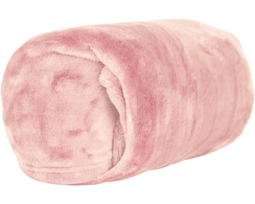 Couverture polaire rose douce et roulée.