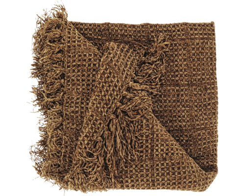 Couverture avec structure gaufrée et franges en marron.