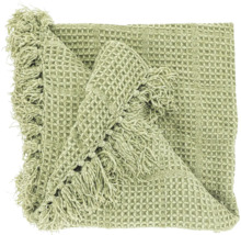 Plaid vert avec structure en nid d abeille et franges.