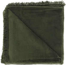 Plaid vert avec franges, plié.
