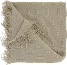 Plaid en tricot avec motif en nid d'abeille et franges.
