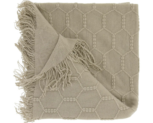 Plaid en tricot avec motif en nid d'abeille et franges.