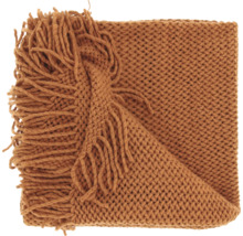Plaid en grosse maille de couleur rouille avec franges.