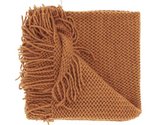 Plaid en grosse maille de couleur rouille avec franges.