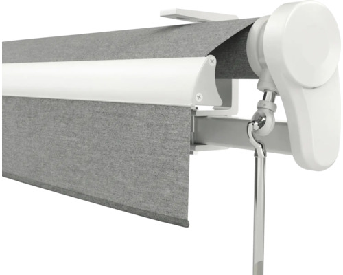 Graue Markise mit weißem Rahmen und Kurbelmechanismus zur manuellen Bedienung.