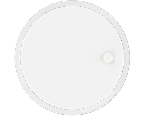 Détecteur de fumée blanc et rond au design plat avec un petit bouton circulaire sur le côté.