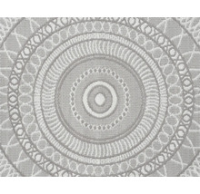 Tapis rond avec motif mandala circulaire et structure de surface tissée.