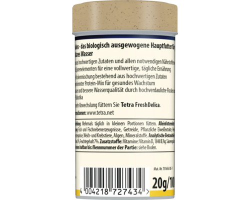 Dos d'une boîte de nourriture Tetra pour poissons avec des informations sur les ingrédients, les conseils d'alimentation et le code-barres.