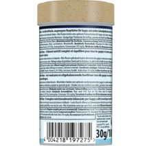 Dos d'un emballage de nourriture pour poissons Mini Flakes pour guppys avec ingrédients, instructions d'alimentation et code-barres, 30 grammes.