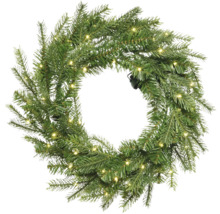 Couronne de sapin artificielle avec éclairage LED intégré en blanc chaud.