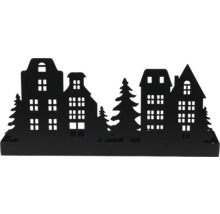 Silhouette décorative noire en métal avec maisons et sapins.