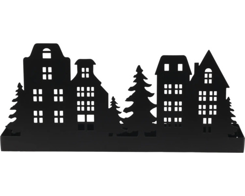 Silhouette décorative noire en métal avec maisons et sapins.