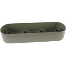 Bougeoir ovale gris avec surface nervurée et quatre inserts pour bougies.