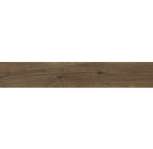 Revêtement de sol brun foncé aspect bois avec veinage, nœuds et fissures.