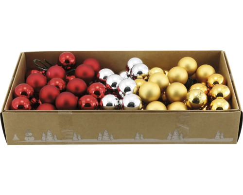 Boules de Noël en rouge, argent et or dans une boîte décorative avec des motifs d'hiver.