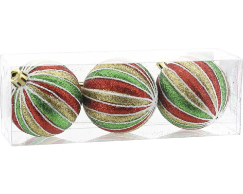 Trois boules de Noël avec un motif de rayures pailletées rouges, vertes et dorées dans une boîte.