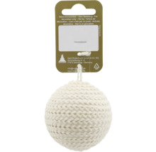 Boule de Noël tricotée en textile sur un support en carton avec GEROMA Logo et avertissement de sécurité.