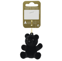 Petit pendentif décoratif ours en peluche noir avec cordon de suspension.