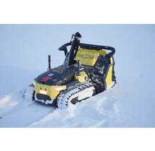 Autonome Schneefräse auf Raupenketten im Einsatz im Schnee.