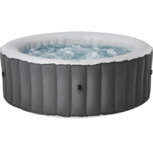 Spa gonflable gris avec eau bouillonnante et paroi extérieure nervurée.