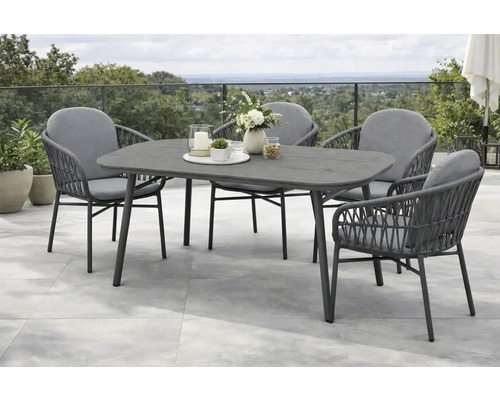 Ensemble de mobilier de jardin moderne composé d une table ovale et de quatre fauteuils avec tressage en corde et coussins sur une terrasse.