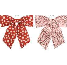 Deux nœuds décoratifs en textile à pois rouges et blancs, avec anneau métallique de suspension.