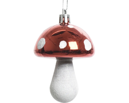 Décoration pour sapin de Noël en forme de champignon avec chapeau rouge et points blancs.