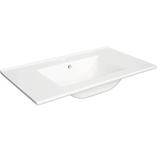 Vasque de meuble rectangulaire blanche en céramique avec trou de robinetterie et trop-plein.