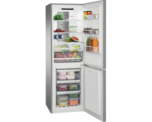 Réfrigérateur combiné ouvert en aspect acier inoxydable, rempli de fruits frais, légumes, boissons et produits surgelés dans des tiroirs.