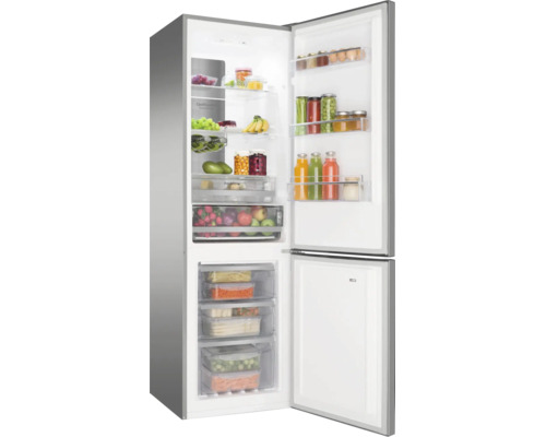 Réfrigérateur combiné ouvert rempli d aliments, avec diverses étagères et tiroirs pour les fruits et légumes.