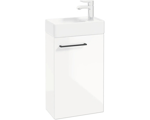 Meuble sous-vasque blanc pour toilettes d'invités avec lavabo, poignée noire et robinet chromé.