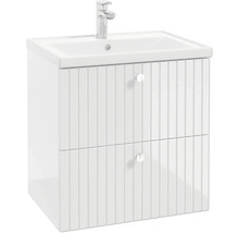 Meuble sous-lavabo blanc avec façades de tiroirs rainurées, lavabo et robinet.