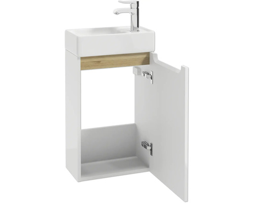 Meuble lave-mains pour WC d'invités avec porte ouverte, meuble blanc avec accent bois, vasque et robinet chromé.