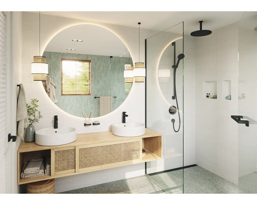 Salle de bains moderne avec double vasque en bois, miroir rond avec éclairage et douche à l italienne avec robinetterie noire.