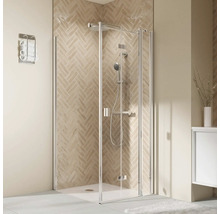 Moderne Eckdusche mit Glaswänden, Chrom-Armaturen und beigefarbenen Fliesen im Fischgrätenmuster.