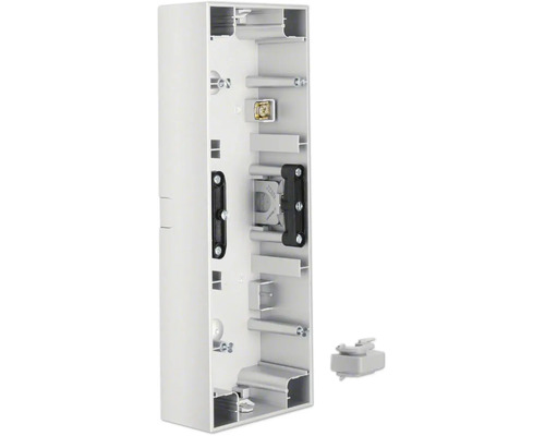 Boîtier saillant en plastique pour installations électriques avec points de fixation intégrés.